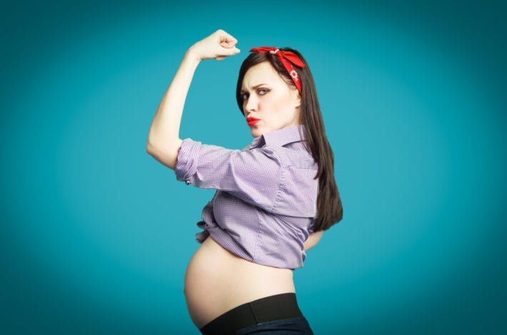 Pregnant woman looking strong - benefits of exercising during pregnancy