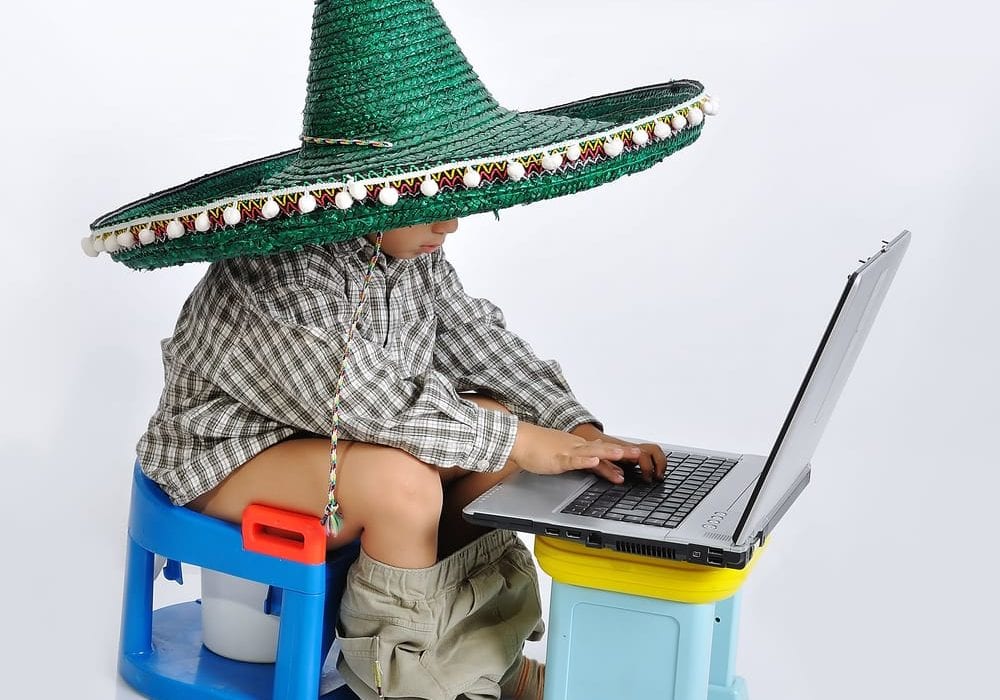 how to potty train - mexican kid on laptop