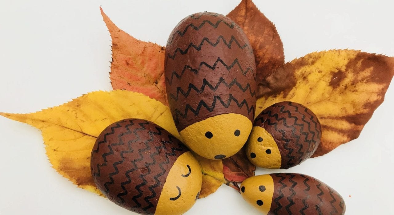 Hedgehog pebble family on leaves finished result - fun kids crafts