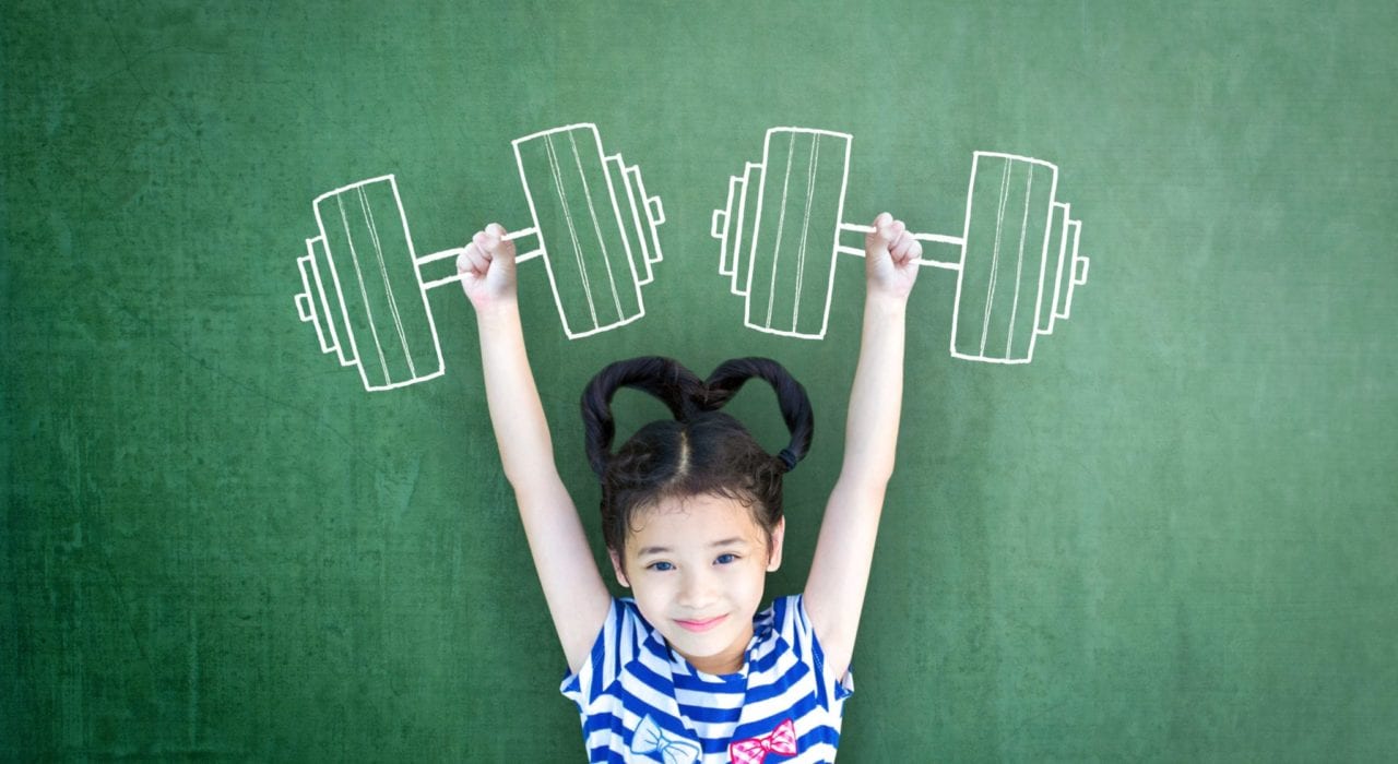 Little girl showing strength