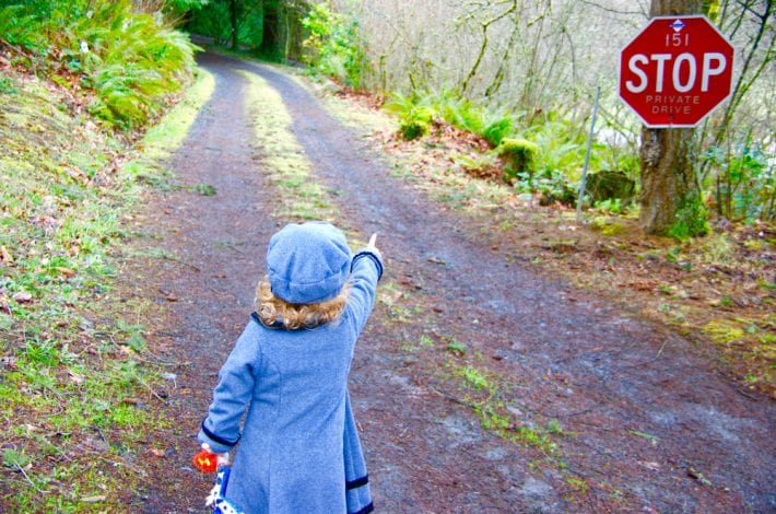 Toddler pointing at STOP streetsign - recognising letters