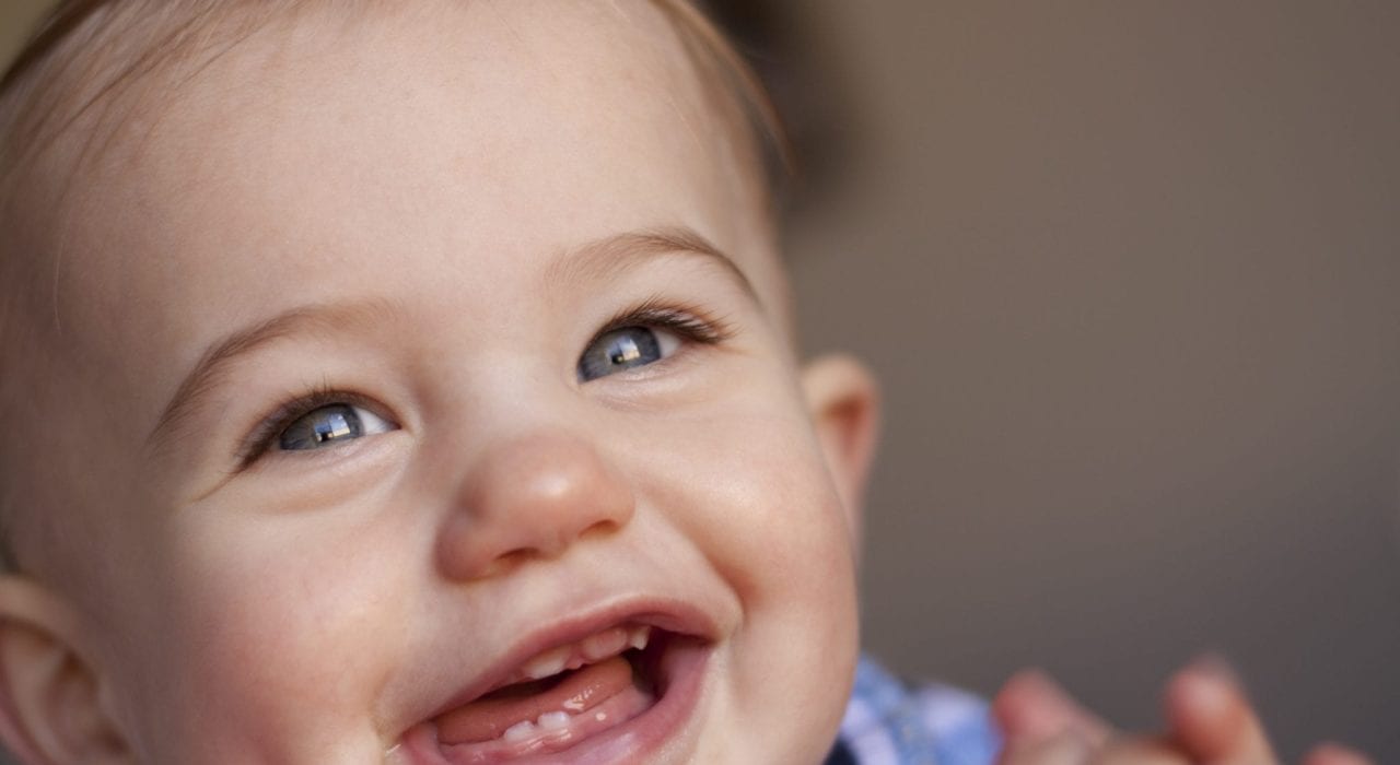 baby teething first teeth smiling