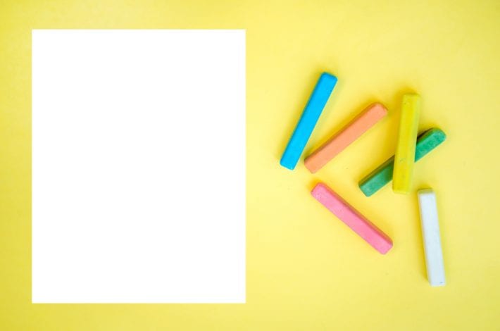 white paper with crayons ready for letters