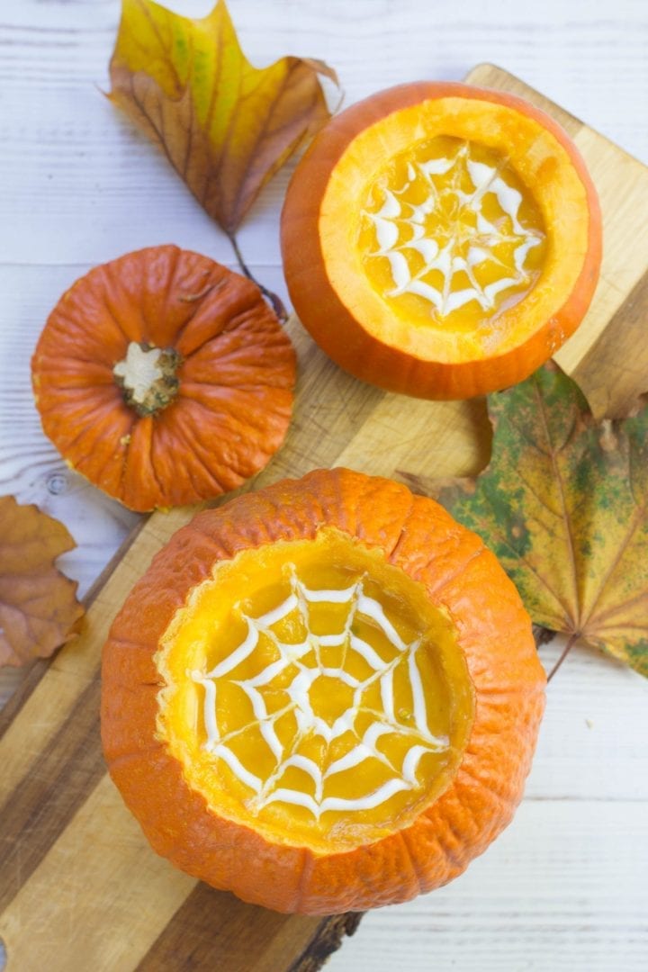 Make this classic squash and pumpkin soup this Halloween - creamy pumpkin soup with rosemary and served in pumpkin shells