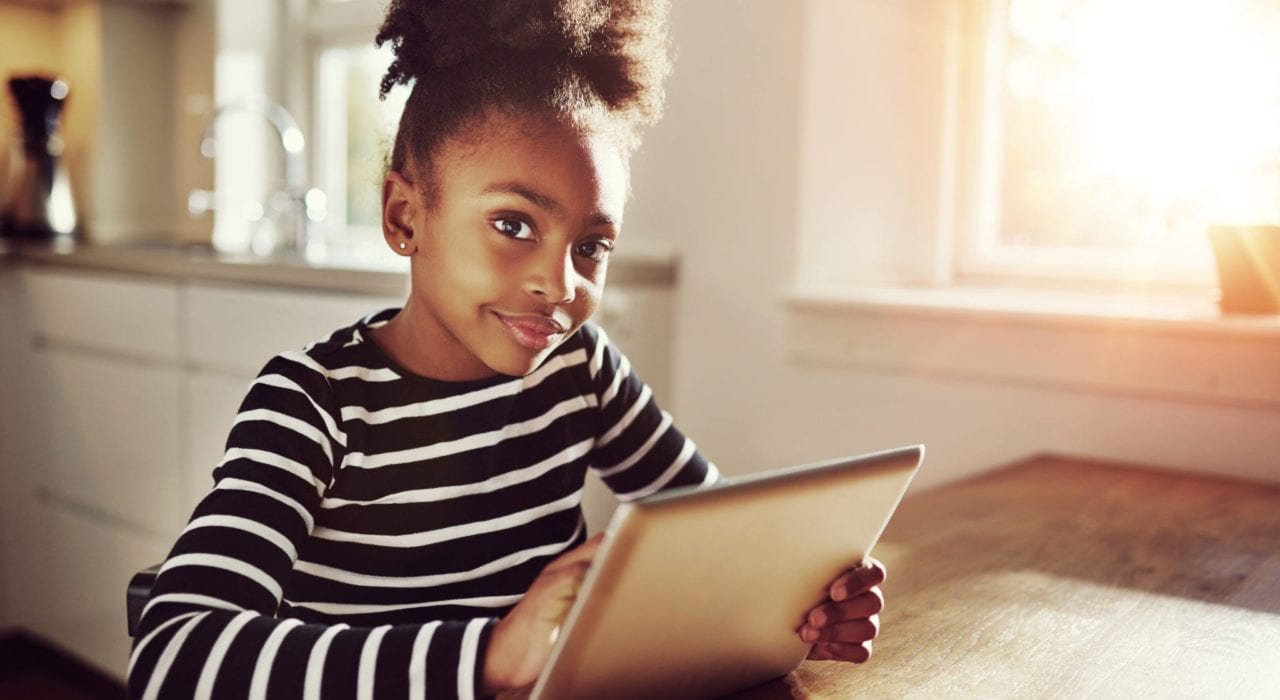 child safe online - young girl surfing the internet