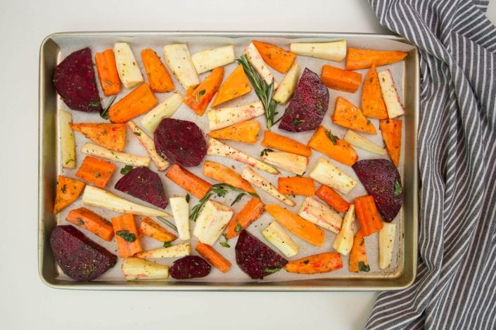 Roast beetroot and root vegetables with fresh herbs - perfect for Sunday family lunch