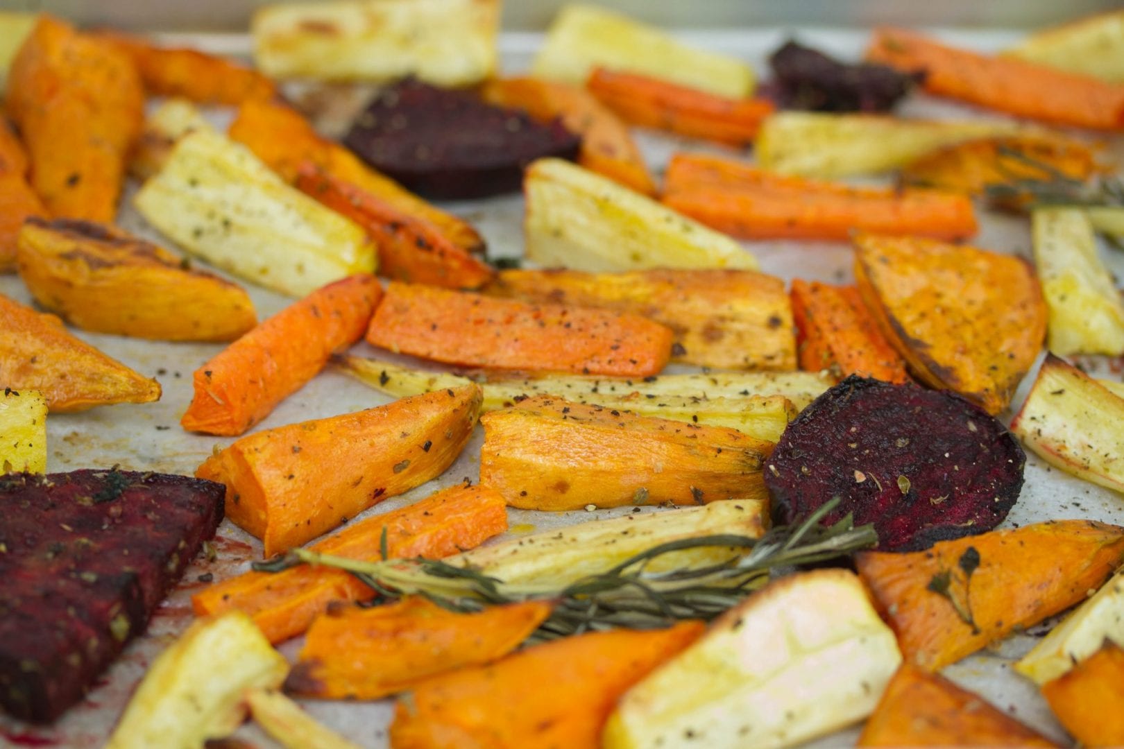 Roast beetroot and root vegetables with fresh herbs - perfect for Sunday family lunch