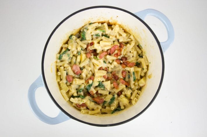 Bacon and apple mac and cheese at its best with slices of apple and a creamy sauce and hidden veggies