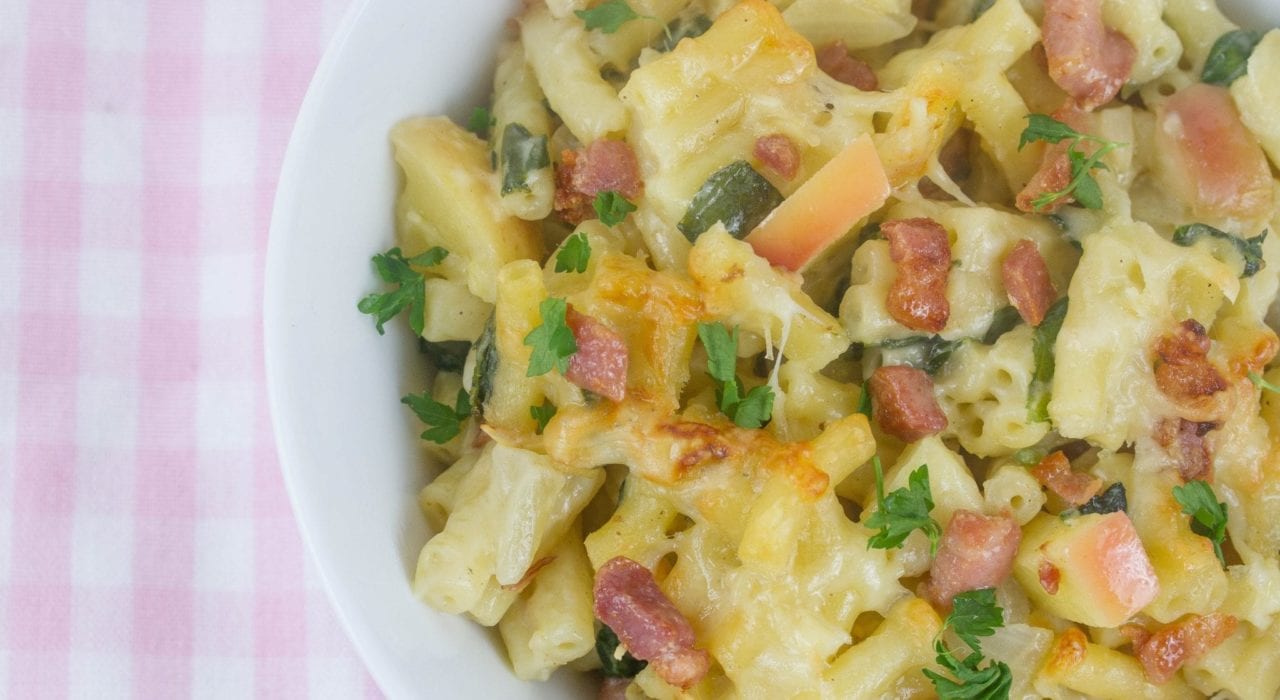 Bacon and apple mac and cheese at its best with slices of apple and a creamy sauce and hidden veggies