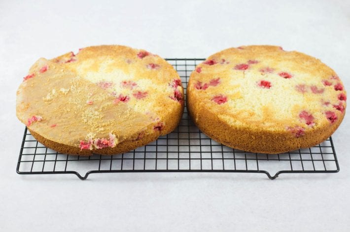 Summer raspberry cake - lemon and raspberry cake layers with a creamy topping #summerraspberrycake #raspberrycake #dessert #summerdessert #cake #summercakes