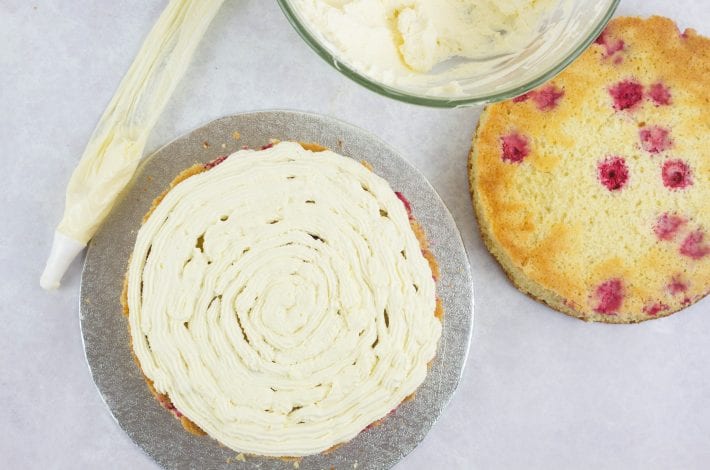 Summer raspberry cake - lemon and raspberry cake layers with a creamy topping #summerraspberrycake #raspberrycake #dessert #summerdessert #cake #summercakes