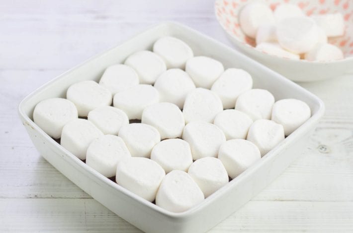 Baked smores bars with an oat base - make these gooey dessert bars for a bonfire night treat